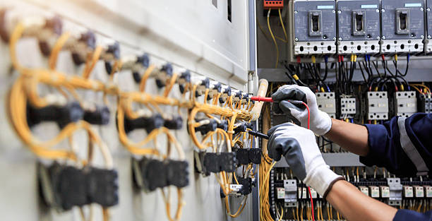 Professional Electrician technician working in Seven Corners, VA